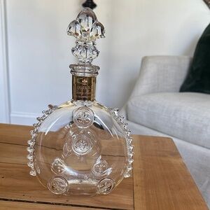 Baccarat crystal decanter with fleur-de-lis motifs.